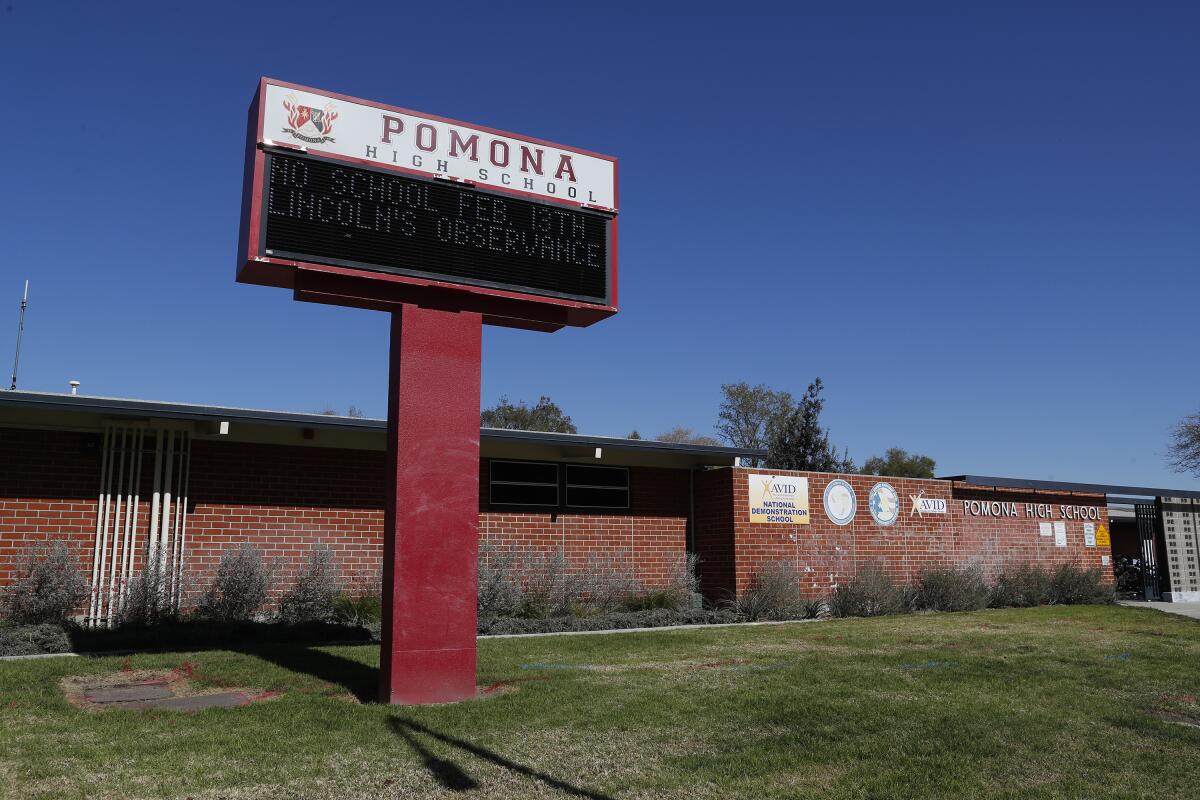 Pomona High School's red brick exterior and sign