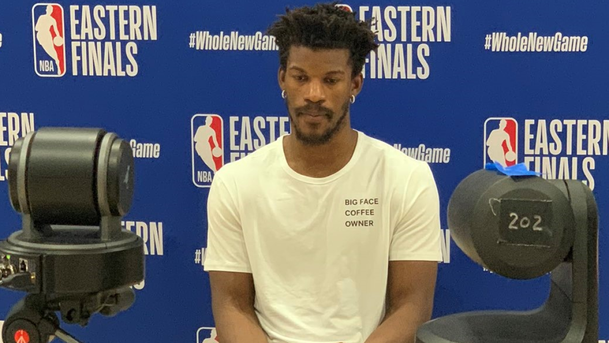 Jimmy Butler speaks to the media wearing a shirt bearing the name of his business, Big Face Coffee.