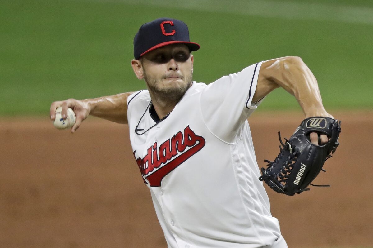 Cleveland Indians relief pitcher Cam Hill delivers in the ninth inning in the second game of a baseball doubleheader against the Chicago White Sox, Tuesday, July 28, 2020, in Cleveland. Indians rookie reliever Cam Hill underwent surgery Monday night, Nov. 30 on his right wrist, after being involved in a car accident in Tulsa, Oklahoma.(AP Photo/Tony Dejak)