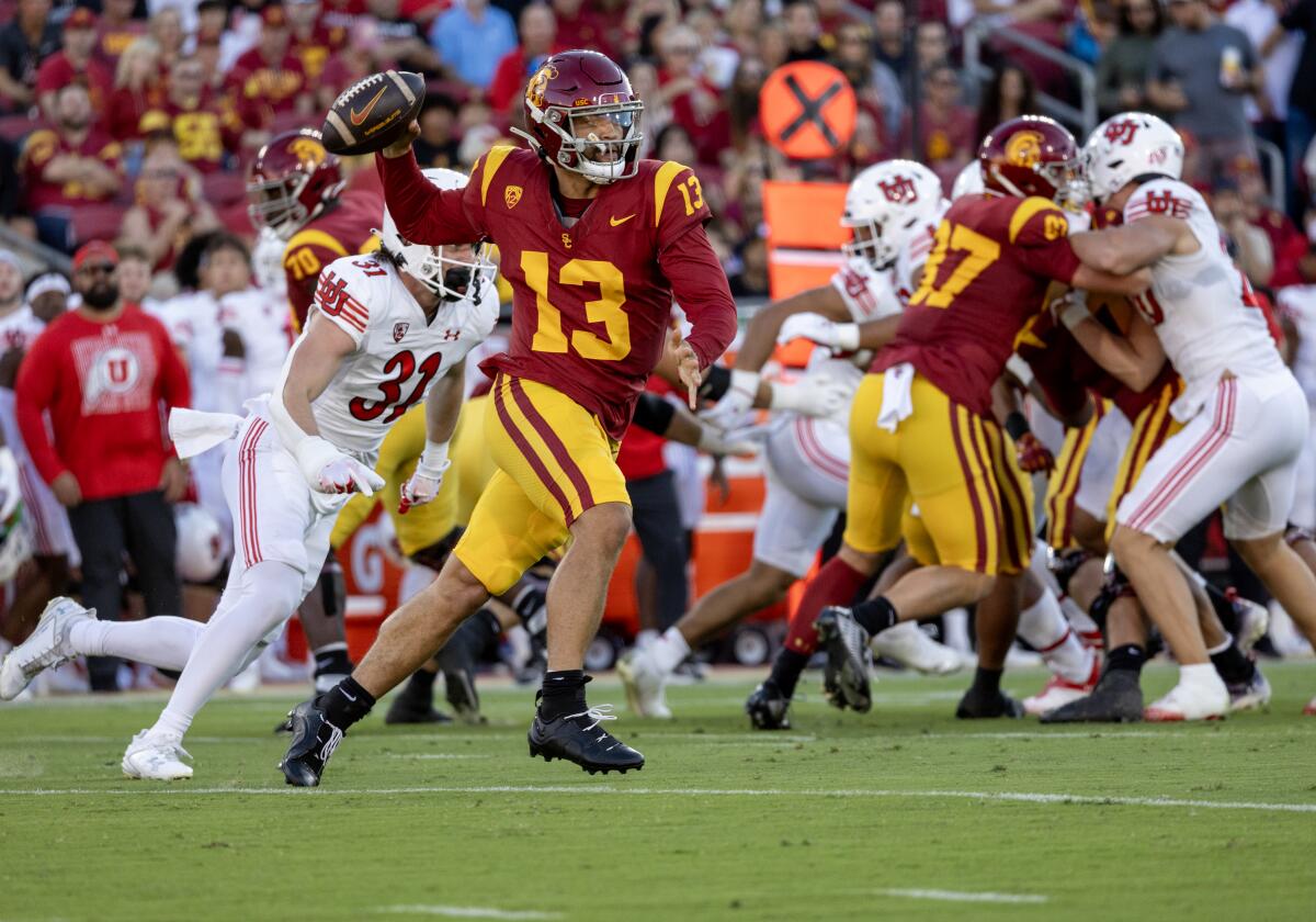 USC quarterback Caleb Williams scampers out of the pocket during a loss to Utah