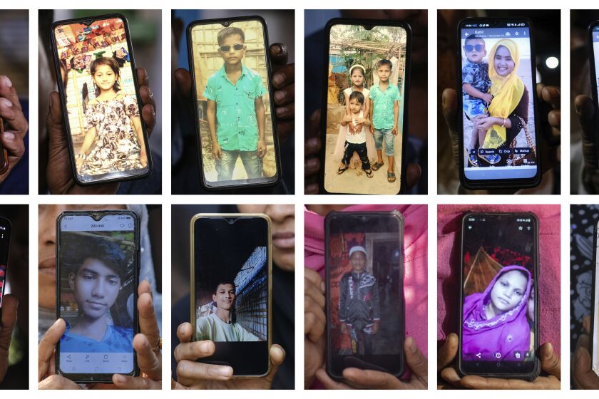 In this combination of photos, relatives hold images of some of those lost when their crowded boat carrying around 180 people sank in the sea south of Bangladesh on Dec. 7, 2022. Top row from left are Muhammed Khanif; Mezanu; Majida Bibi; Dildar Ullah; Majida Bibi and Dildar Ullah; Samira Begum holding her son, Tasin Ahmed; Kabir Ahmed and Saiful. Bottom row from left are Yasmin Ara and Noor Kaida; Ziabul Hoque and Azizul Hoque; Kabir Ahmed; Asmat Ullah; Mubarak Hussain; Asma Bibi; Noor Hassan and Noor Hashim. (AP Photo)