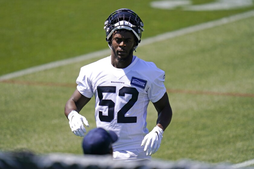 Seattle Seahawks' Darrell Taylor looks on during an NFL football rookie minicamp Friday, May 14, 2021, at the team's training facility in Renton, Wash. (AP Photo/Elaine Thompson)