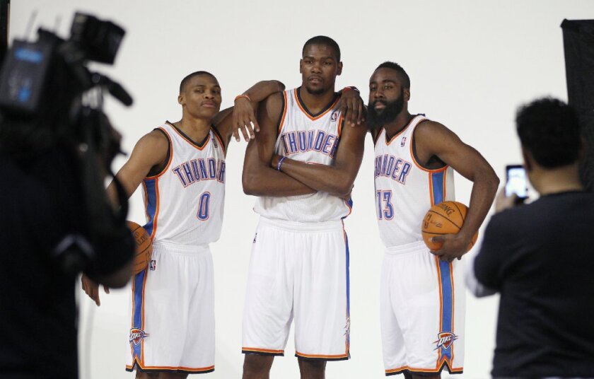 Russell Westbrook (left), Kevin Durant (center) and James Harden pose for a Thunder photo in 2011. All three stars have since departed Oklahoma City.