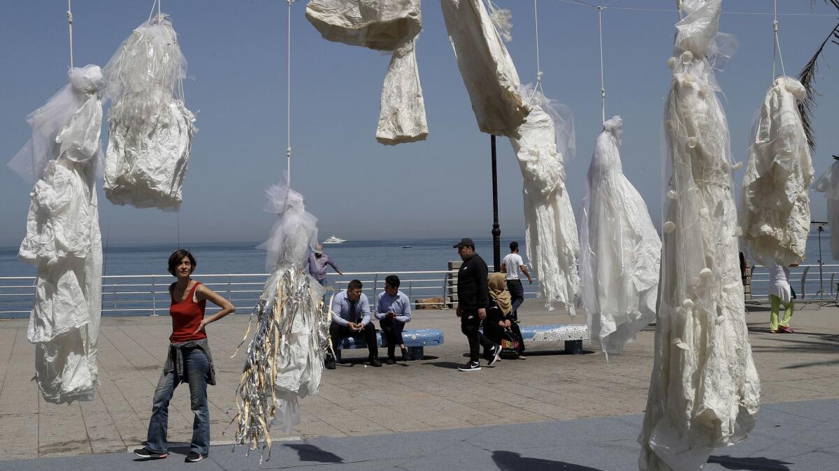 Wedding dresses hang from nooses on the Beirut corniche in a protest of Lebanon's Article 522, which states that a rapist is absolved of his crime if he marries his victim. Jordan's parliament is considering revoking a similar law.