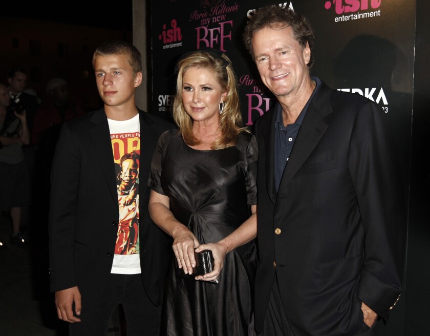 Conrad Hilton, left, with his parents, Kathy Hilton and Rick Hilton, in 2008.