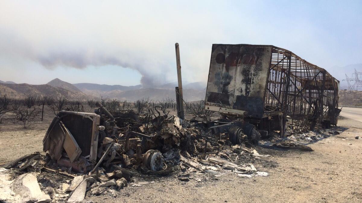 A truck burned in the Blue Cut Fire near Interstate 15 in Lytle Creek, Calif.