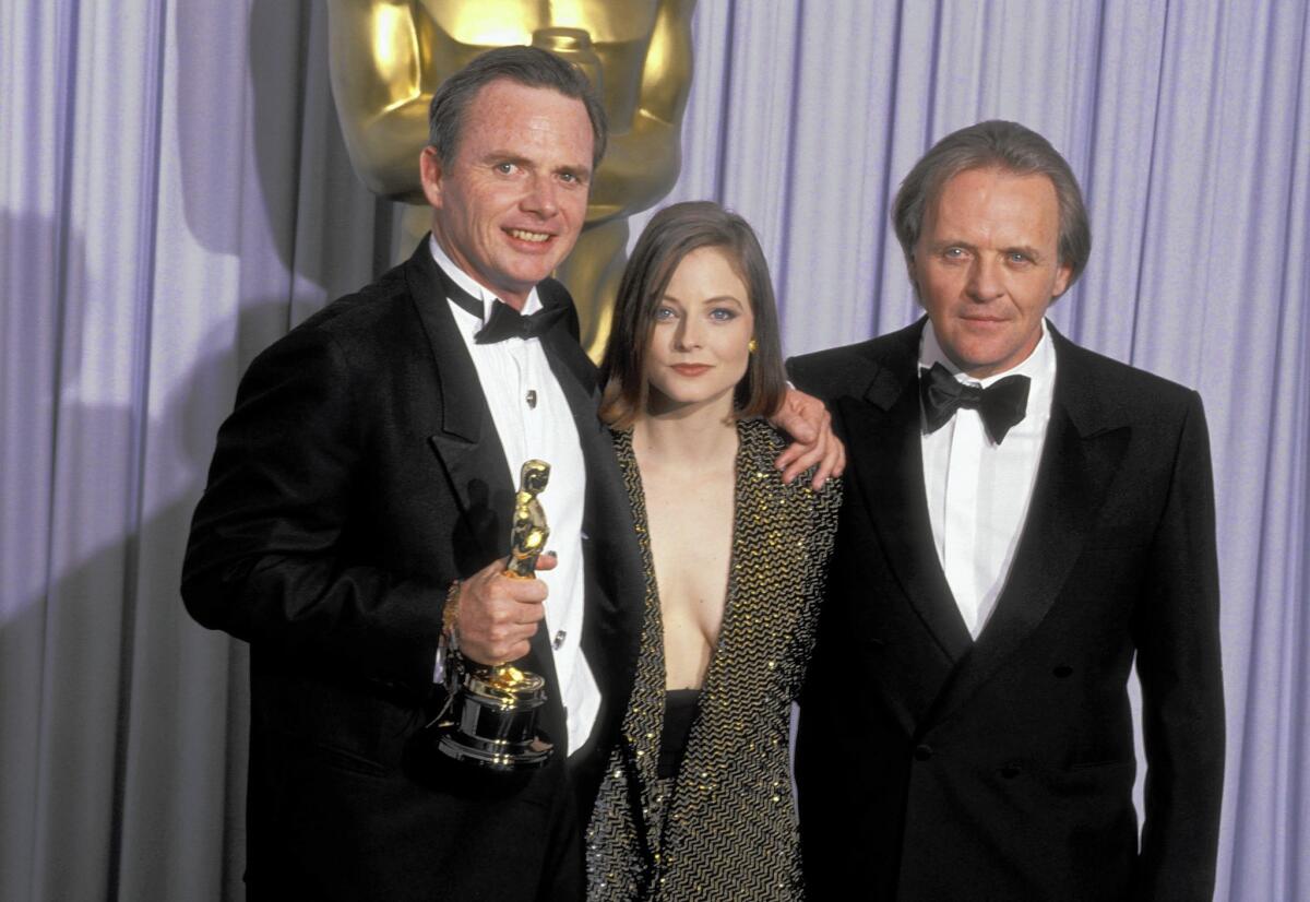 Michael Blake won a 1991 screenwriting Oscar for Kevin Costner’s film “Dances With Wolves,” which became the first western to win a best picture Academy Award since “Cimarron” in 1931. Above, Blake with presenters Jodie Foster and Anthony Hopkins.