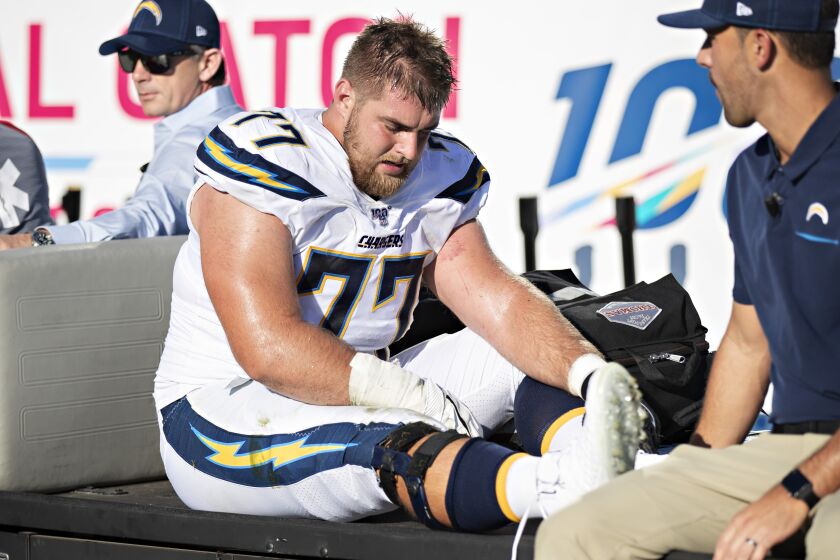 NASHVILLE, TN - OCTOBER 20: Forrest Lamp #77 of the Los Angeles Chargers is carted off the field after being hurt during a game against the Tennessee Titans at Nissan Stadium on October 20, 2019 in Nashville, Tennessee. (Photo by Wesley Hitt/Getty Images)