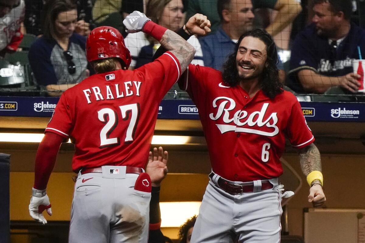 Cincinnati Reds' Jake Fraley celebrates his home run with Jonathan India during the ninth inning of a baseball game against the Milwaukee Brewers Friday, Sept. 9, 2022, in Milwaukee. (AP Photo/Morry Gash)
