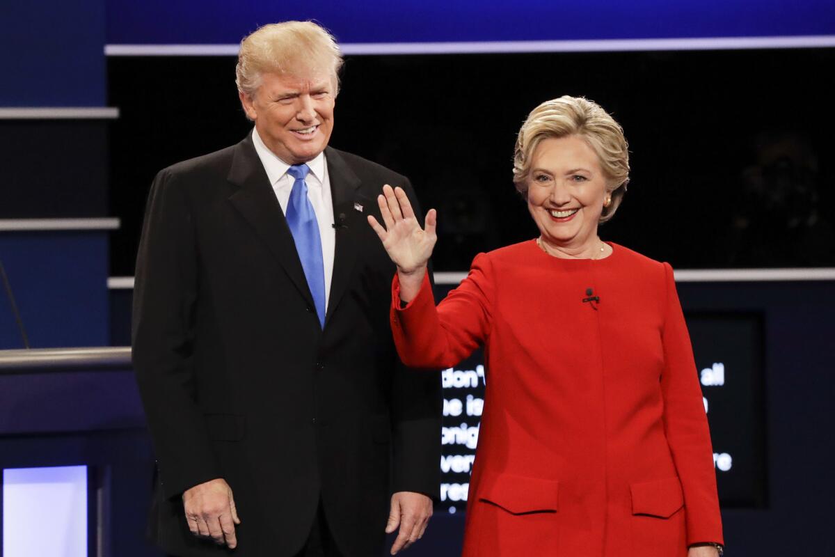 Republican presidential nominee Donald Trump and Democratic presidential nominee Hillary Clinton are introduced during the presidential debate at Hofstra University on Sept. 26, 2016.