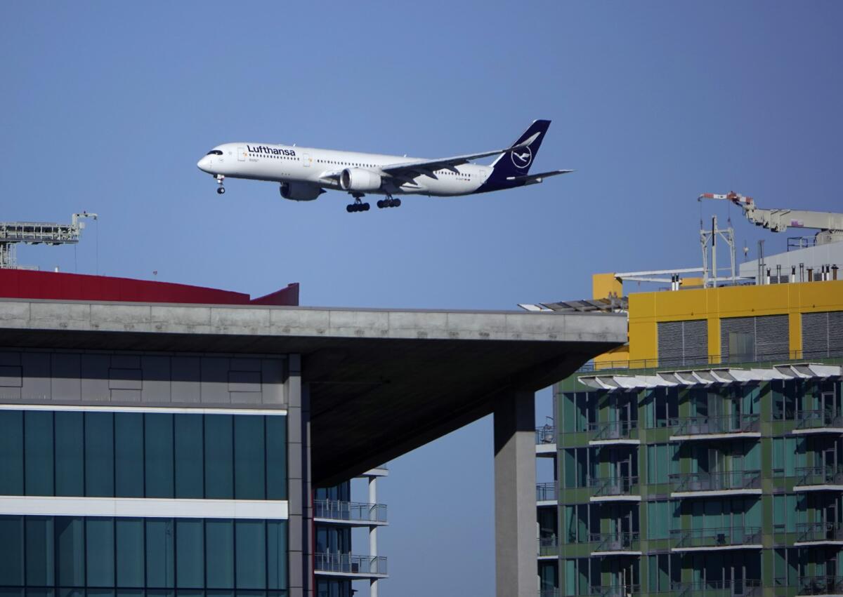 A Lufthansa jet approaches San Diego International Airport for a landing.