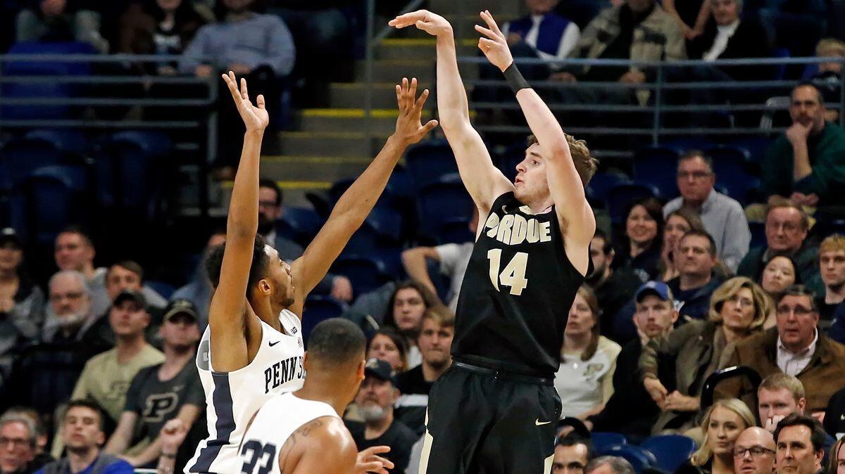 Purdue's Ryan Kline (14) hits a three-pointer to put Purdue ahead for good during overtime on Tuesday.