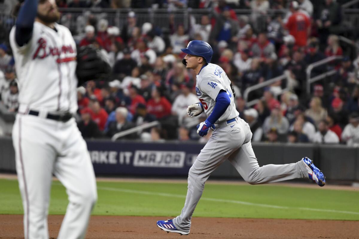 Dodgers shortstop Corey Seager rounds the bases after hitting a two-run home run.