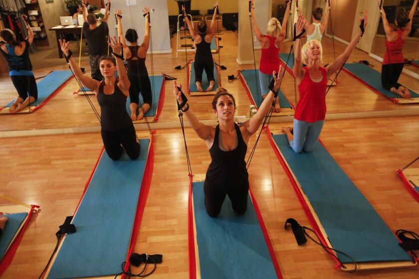Da Vinci BodyBoards are used in a workout led by Lora Pavilack, in red, owner of Studio City Pilates.