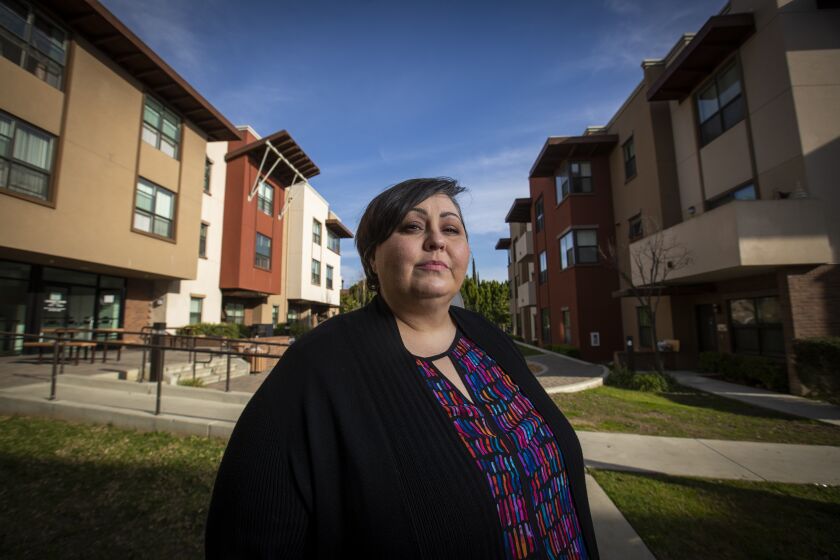 SAN MARCOS, CALIF. -- TUESDAY, JANUARY 14, 2020: Developer Ginger Hitzke, president of of Hitzke Dev. Corp., in front of her affordable housing development, Autumn Terrace in San Marcos. Hitzke has been trying to get a 10-unit affordable housing project built by the beach in Solana Beach for the last 10 years and has yet to break ground. Photo taken on Jan. 14, 2020. (Allen J. Schaben / Los Angeles Times)