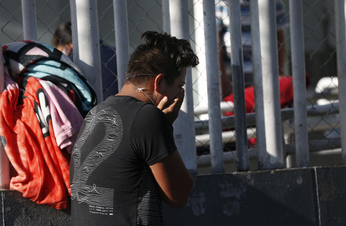 Brando Gonzalez Ortiz cries after receiving the news of his mother Carmen Ortiz’s death of COVID-19 outside Iztapalapa General Hospital in Mexico City on May 3, 2020.