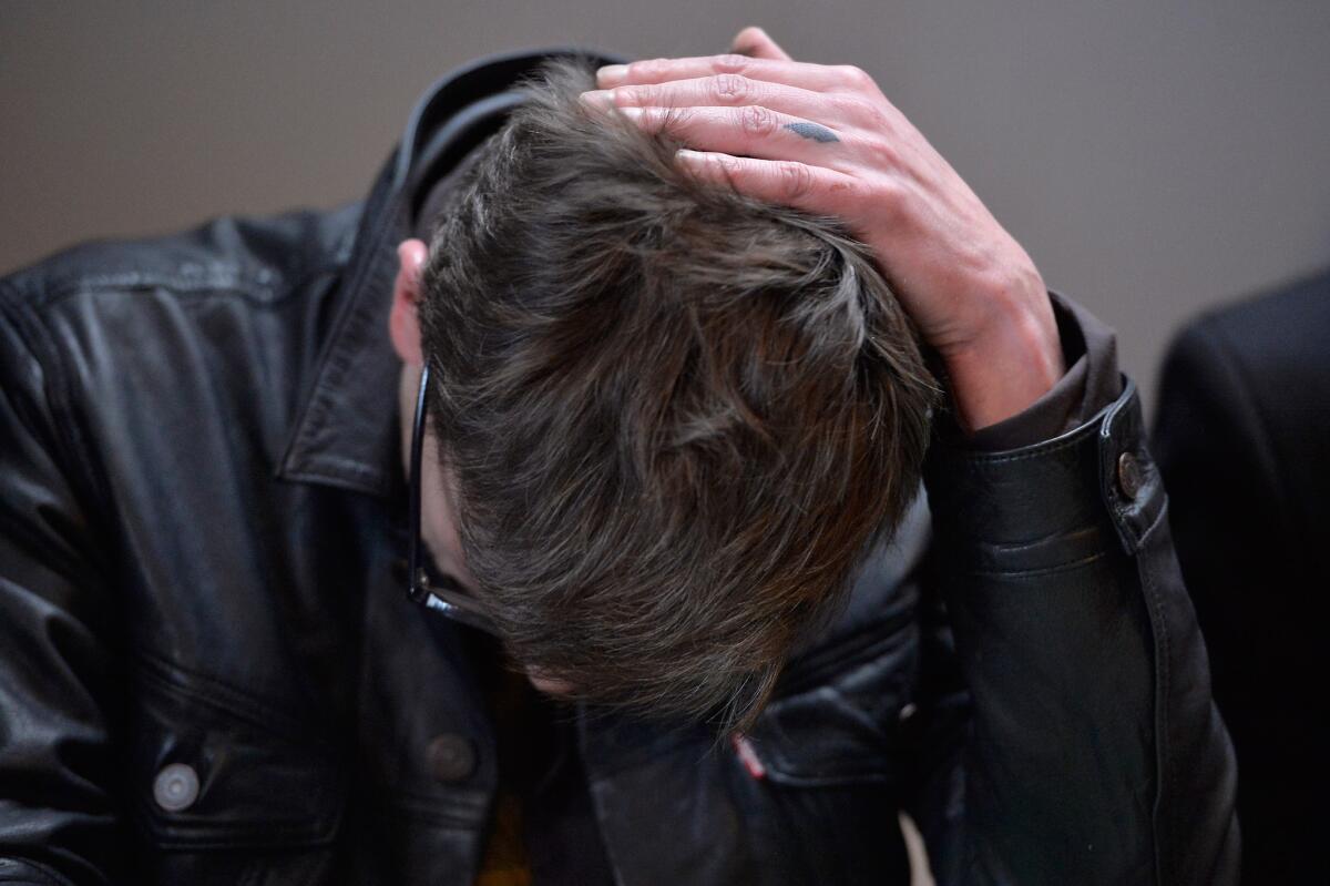 Charlie Hebdo cartoonist Renald "Luz" Luzier reacts during a news conference held at the Liberation offices in Paris on Jan. 13.