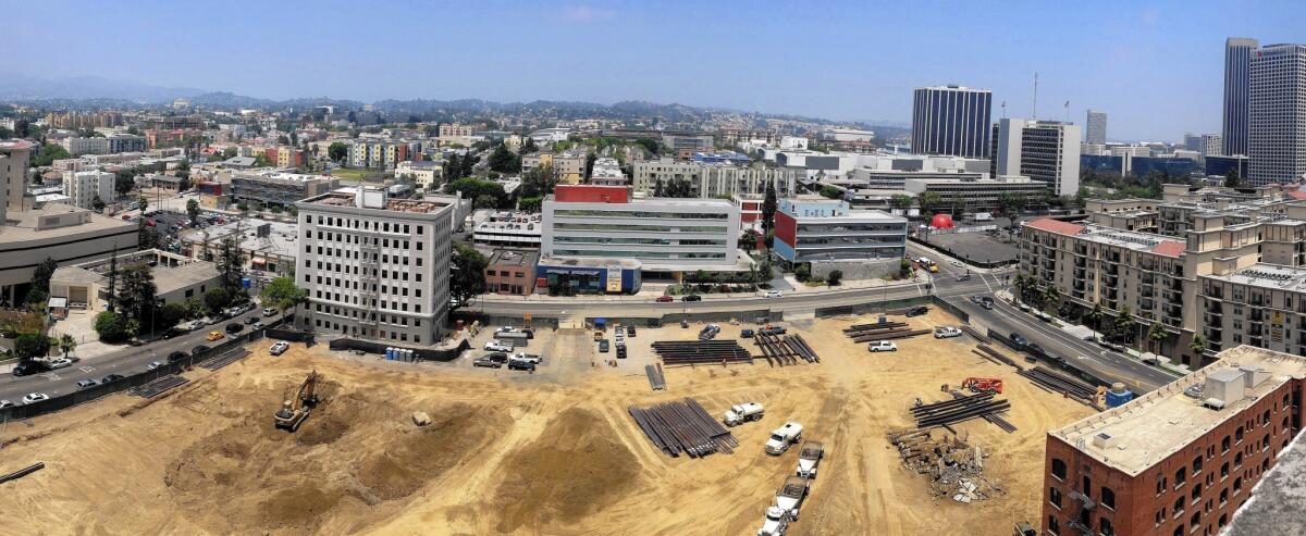 Construction has begun on a 648-unit apartment complex just west of the financial district in downtown L.A. Booming construction has caused several sidewalks to close, to the ire of some pedestrians.