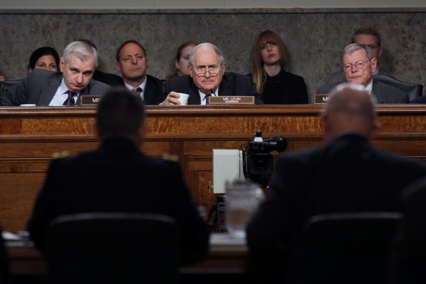 Sen. Carl Levin (D-Mich.), center, chairs a Senate Armed Services Committee meeting Tuesday. He tried without luck last week to broaden congressional oversight of lethal overseas drone strikes.