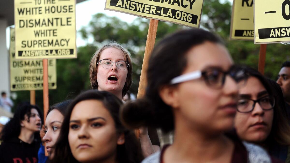 Students gather outside the Titan Student Union at Cal State Fullerton before a speech by Milo Yiannopoulos.