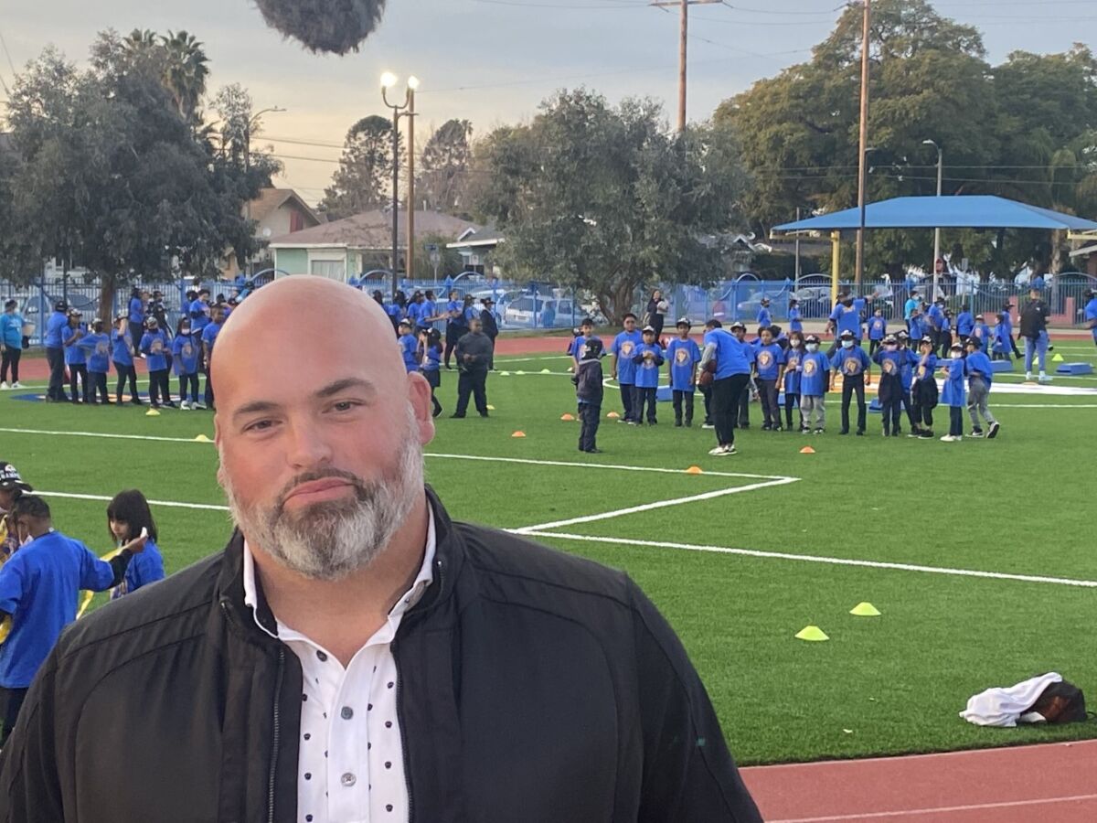 Former Rams lineman Andrew Whitworth at new field his NFL grant paid for in South Los Angeles.