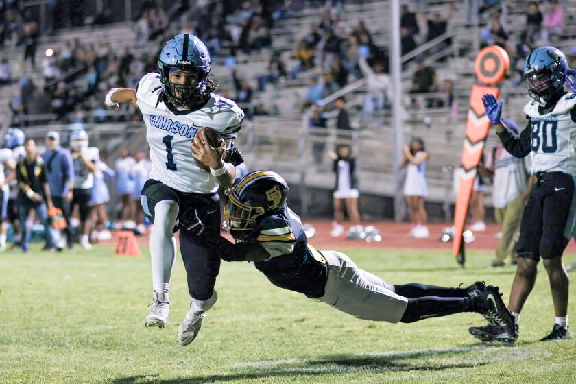 Carson quarterback Chris Fields III takes off on run against San Pedro. He ran for two touchdowns and passed for three touchdowns.