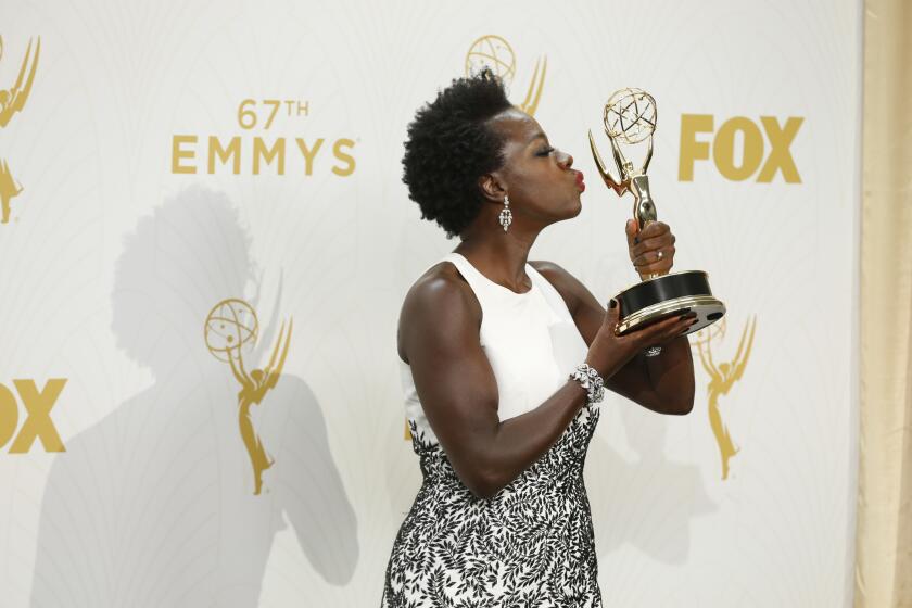 Viola Davis poses with her award at the Primetime Emmy Awards at the Microsoft Theater on Sept. 20.
