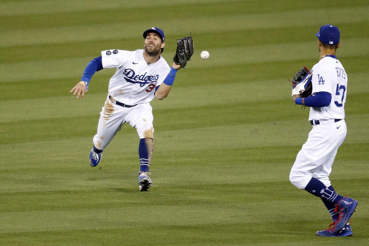 Dodgers center fielder Chris Taylor commits a fielding error on a ball hit by Arizona Diamondbacks' Josh Reddick.