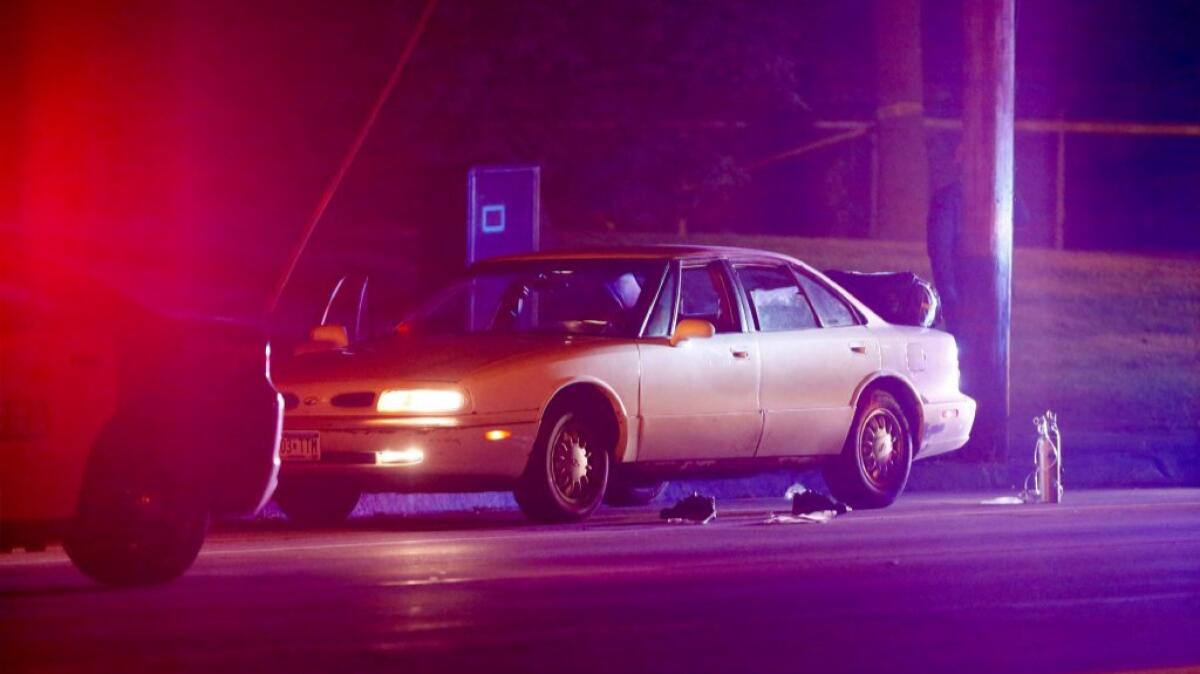 A car is illuminated by floodlights at the scene of the fatal shooting of Philando Castile by a police officer in Falcon Heights, Minn. on July 6.