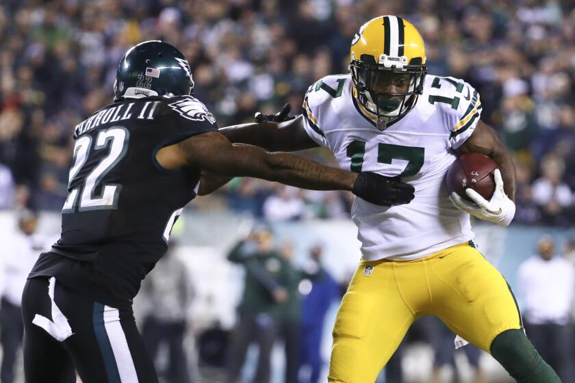 Packers receiver Davante Adams (17) runs with the ball against Eagles defender Nolan Carroll (22) in the fourth quarter on Nov. 28.