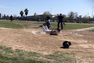 Ruben Lira of Sun Valley Poly slides in safely to score during a 4-3 win over North Hollywood.