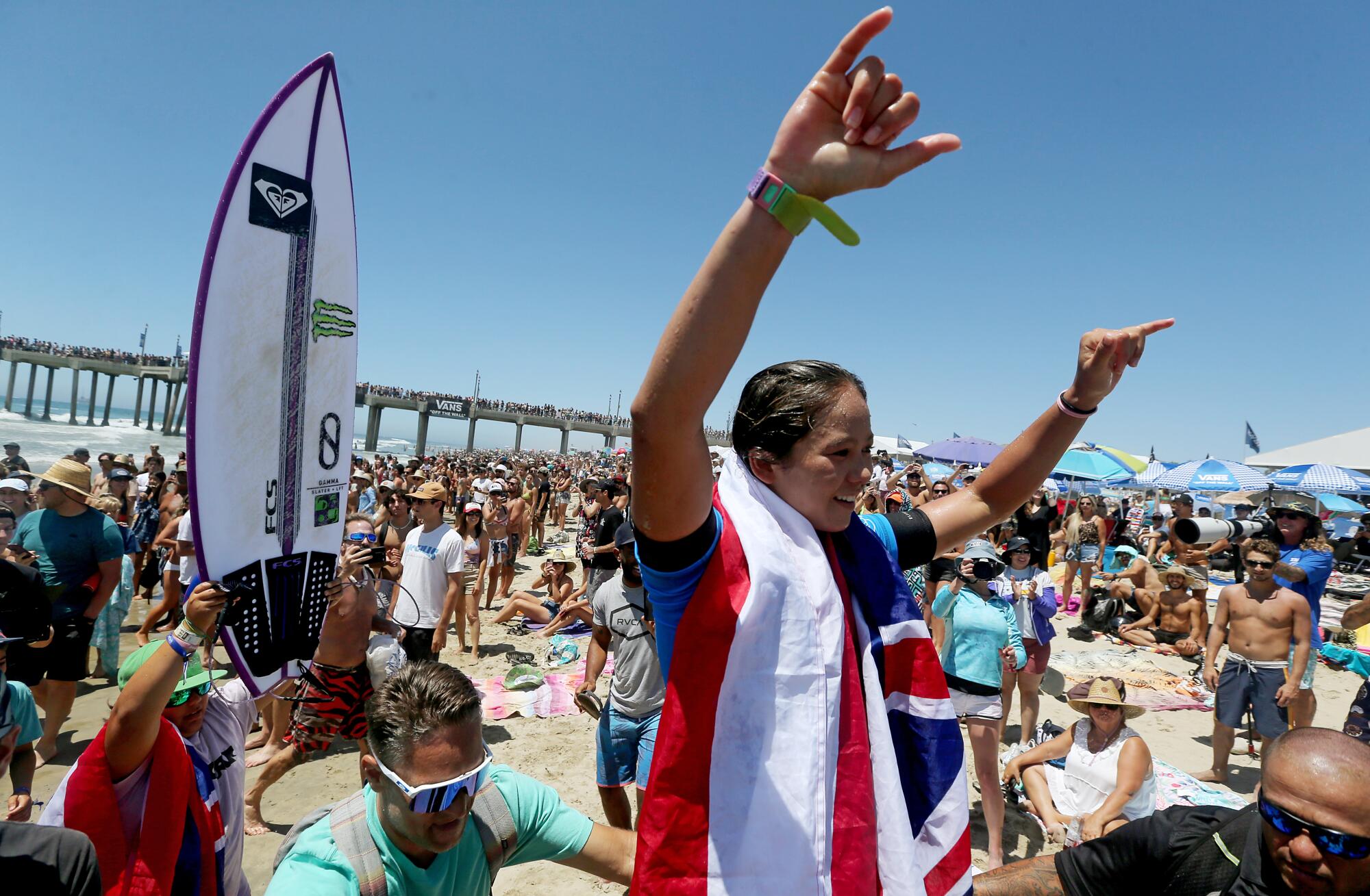 Bettylou Sakura of Hawaii celebrates after winning the U.S. Open of Surfing women's title.