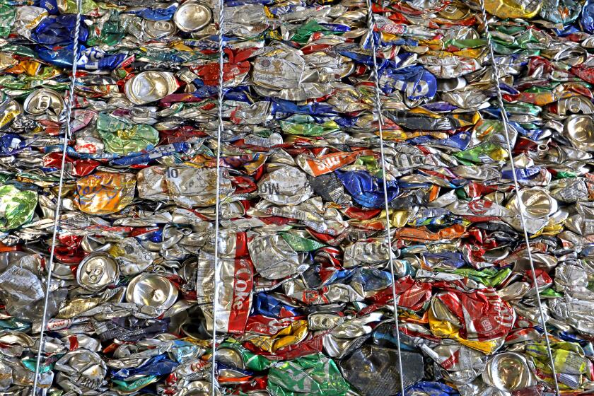 BURBANK, CALIFORNIA--JULY 26, 2019--At the Burbank Recycling Center, a bundle of aluminum cans are packed and ready to be sold. Unlike plastic bottles, there is still a market for aluminum cans. About a decade back, the Burbank Recycling Center earned roughly $50,000 a month on recycled materials. In the past year, the value of recycled goods plunged so low they were paying as much as $40,000 a month to outlets overseas just to get rid of it. ItÕs gotten so expensive that the center is resorting to the landfill. (Carolyn Cole/Los Angeles Times)