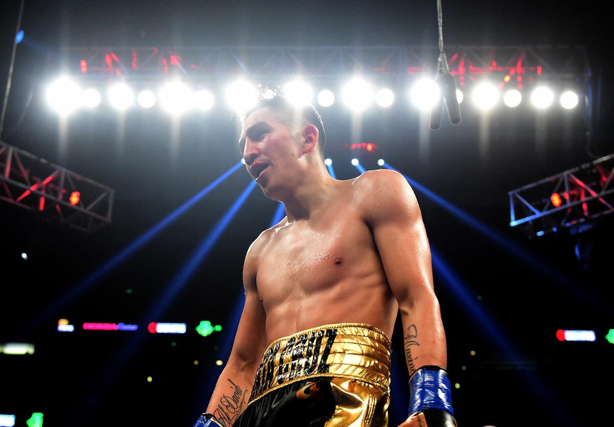 Leo Santa Cruz celebrates a fifth-round TKO of Kiko Martinez on Feb. 27.