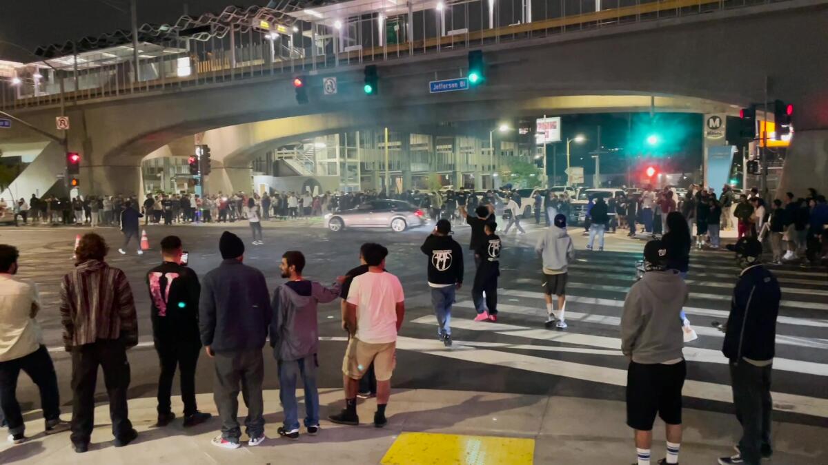 A crowd of mostly young people is at Rosecrans and Central in Compton