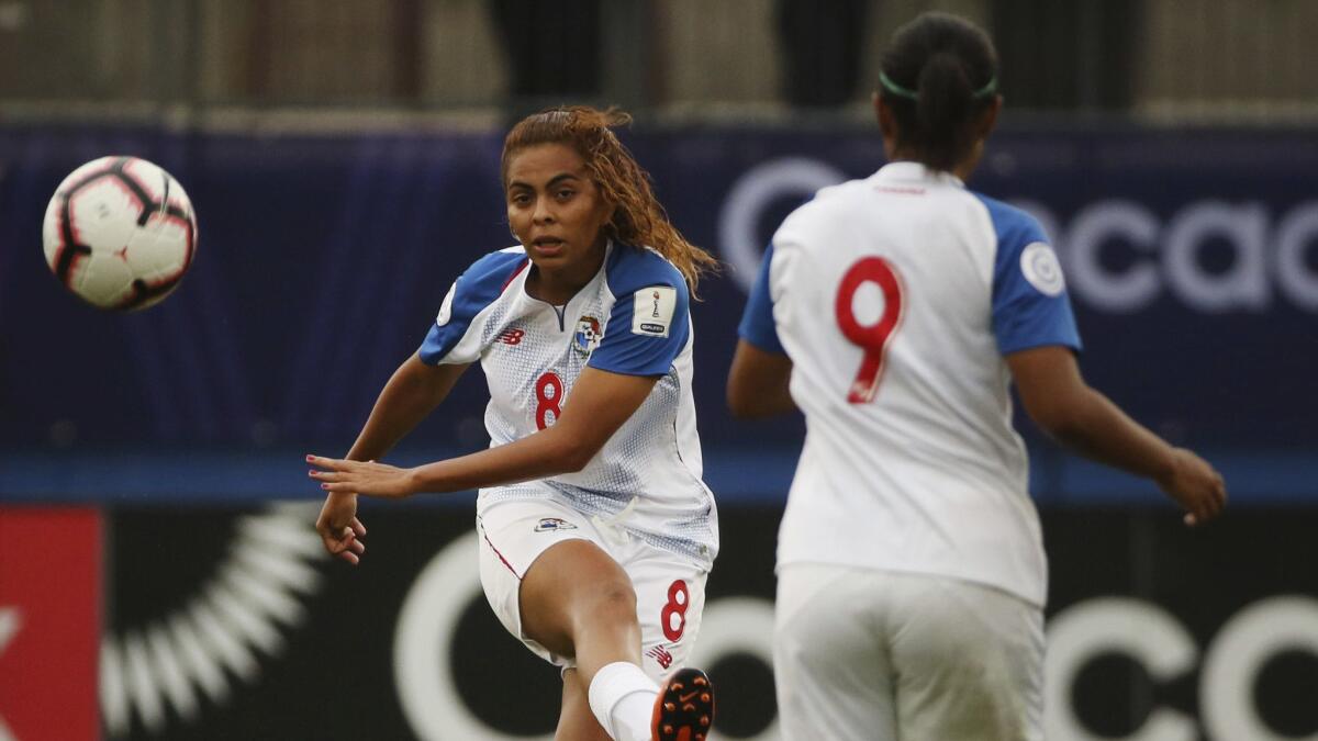 Panama midfielder Laurie Batista (8) advances the ball near midfielder Karla Riley during the first half of a CONCACAF Women's Championship game against Canada on Sunday in Frisco, Texas.