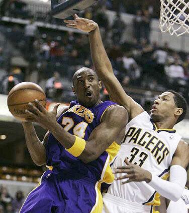 Lakers Kobe Bryant is defended by Danny Granger of the Indiana Pacers during the first quarter Tuesday.