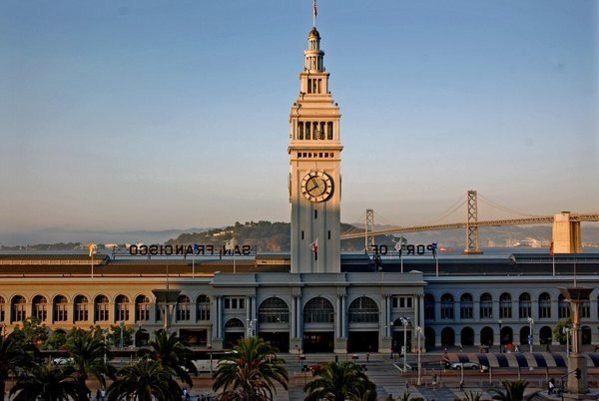 San Francisco’s Ferry Building sits along the Embarcadero at the foot of Market Street. The city has banned group events of more than 50 people at many facilities amid the spread of coronavirus.