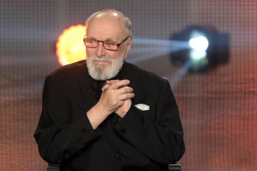 Conductor Kurt Masur sits in a wheelchair as he is awarded the "Goldene Henne" media prize in Leipzig, eastern Germany. The New York Philharmonic said Masur, from Germany, has died at 88.