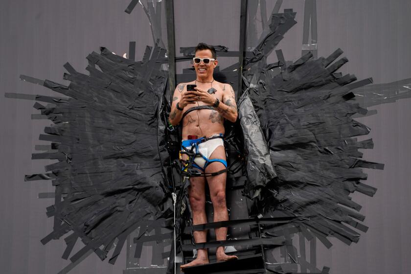 LOS ANGELES, CA - AUGUST 13: Actor Steve-O is seen taped to a Hollywood billboard along Cahuenga Boulevard on Thursday, Aug. 13, 2020 in Los Angeles, CA. Steve-O, the star from MTV's Jackass series, is promoting his new project, "Gnarly." (Kent Nishimura / Los Angeles Times)