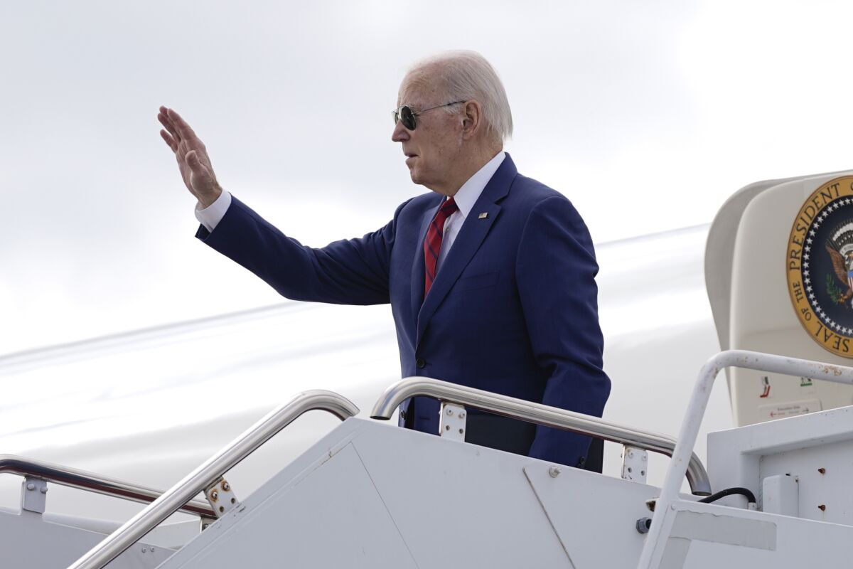 President Joe Biden waves before boarding Air Force One at Delaware Air National Guard Base in New Castle, Del., Sunday, March 5, 2023. Biden is traveling to Selma, Ala., to commemorate the 58th anniversary of "Bloody Sunday," a landmark event of the civil rights movement. (AP Photo/Patrick Semansky)