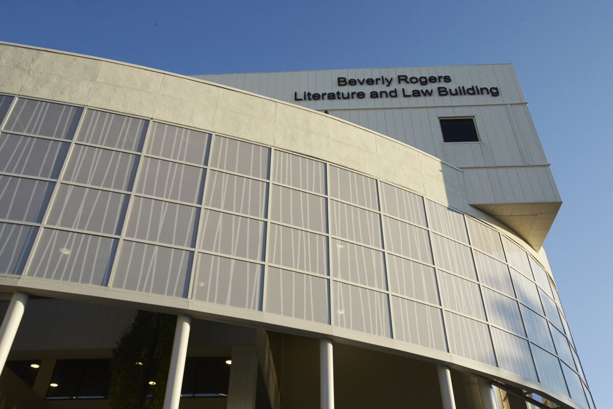 A building with a sign saying The Beverly Rogers Literature and Law Building 