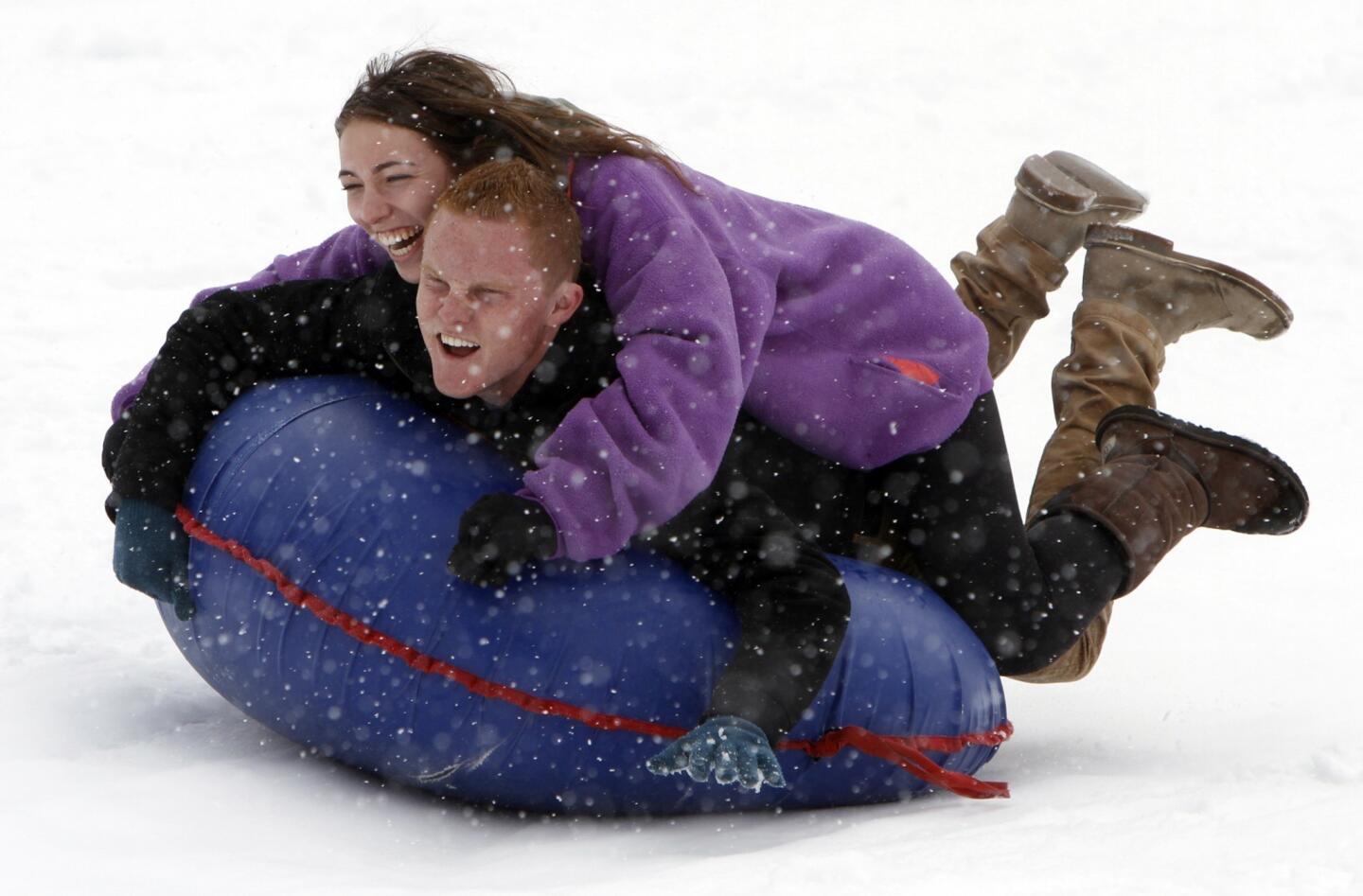 Jonah Lavin, 19, and girlfriend Sascha Spiegel 18, enjoy sledding at Big Bear Snow Play.