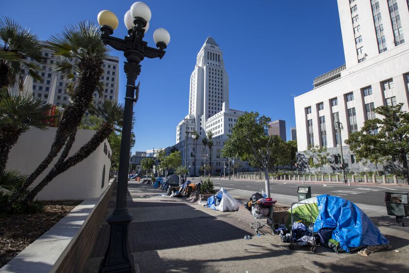 Los Angeles, CA - January 21: Homeless sleep in tents lining the sidewalk along Los Angeles Street downtown Los Angeles Thursday, Jan. 21, 2021. (Allen J. Schaben / Los Angeles Times)