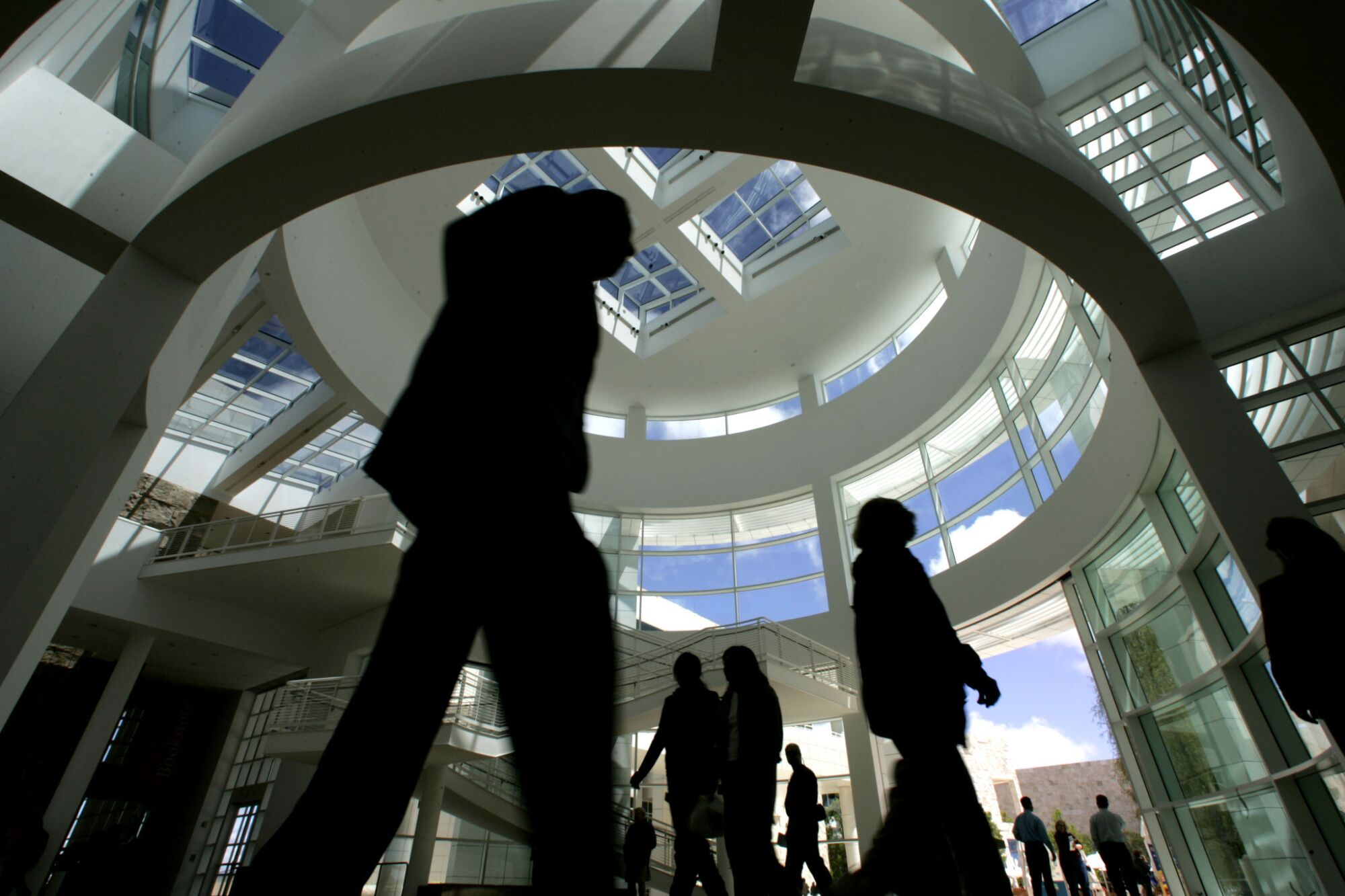 Visitors to the Getty Center walk through the main lobby atrium prior to the pandemic