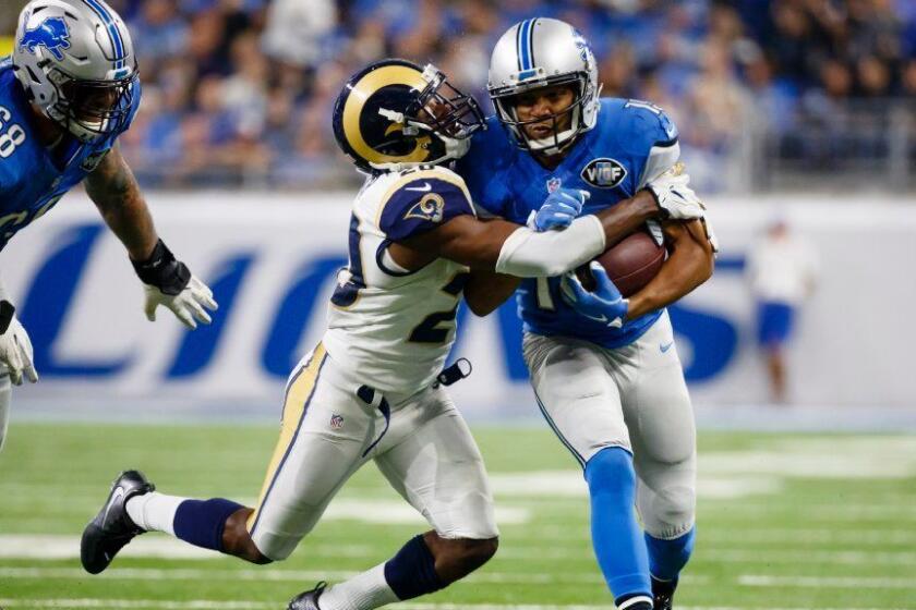 Lions receiver Golden Tate is tackled by Rams cornerback Lamarcus Joyner during a game on Oct. 16.