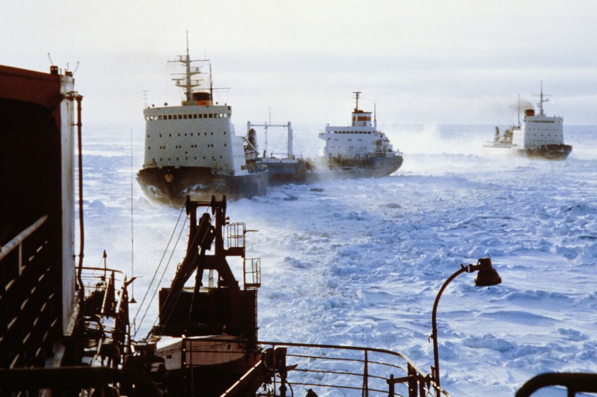 A convoy of Russian icebreakers clear a shipping lane through Arctic ice in January 2013. As melting ice opens access to Arctic shipping for longer periods each year, Canada has joined Russia and Denmark in pursuing the rights to maritime control and resource harvesting in the Arctic.