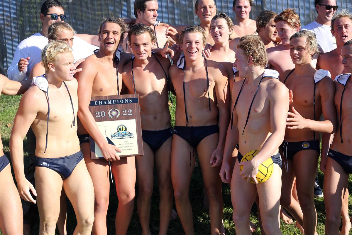 The Newport Harbor High boys' water polo team is all smiles after winning the championship game against JSerra on Saturday.