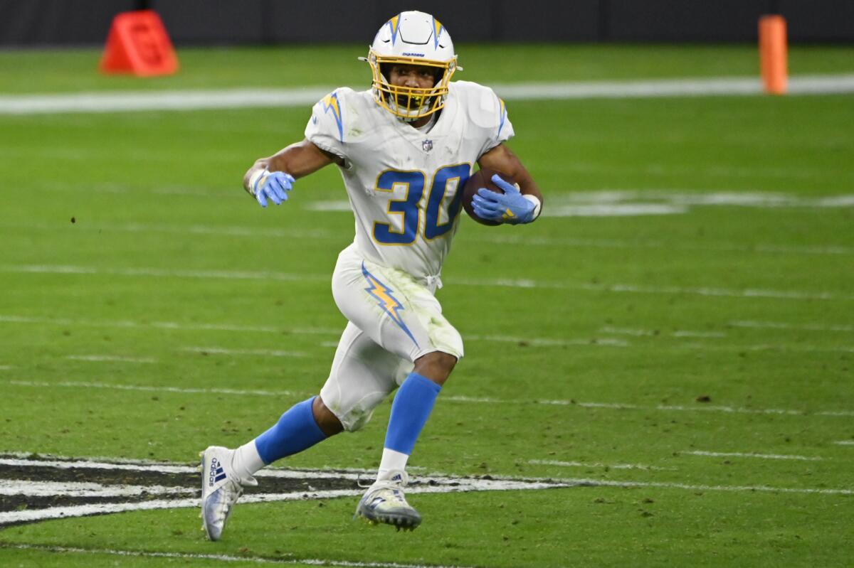 Chargers running back Austin Ekeler finds open field against the Raiders defense in Week 16.