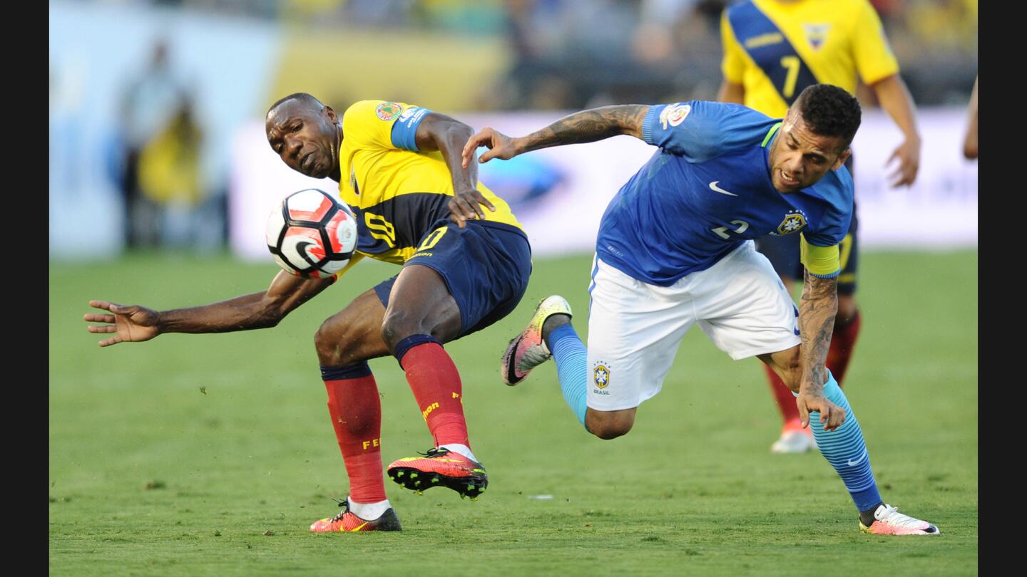 Ecuador's Walter Ayom battles Brazil's Dani Alves for the ball in the first half of a group game for the Copa America Centenario on Saturday at the Rose Bowl.